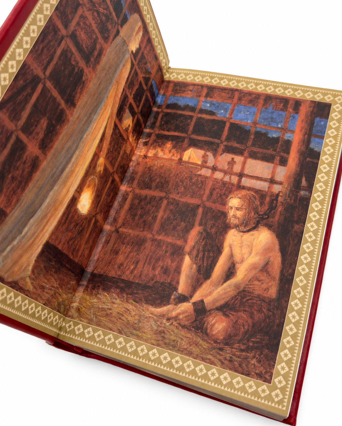 A Clash of Kings HarperVoyager edition open to the prisoner illustration